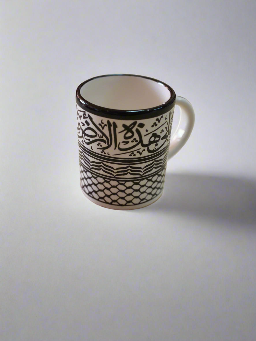 Black and white patterned mug on a wooden surface