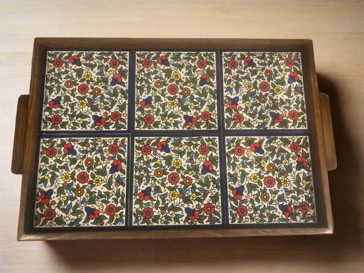 Wooden tray with floral patterned tiles on a wooden surface hand made in Palestine