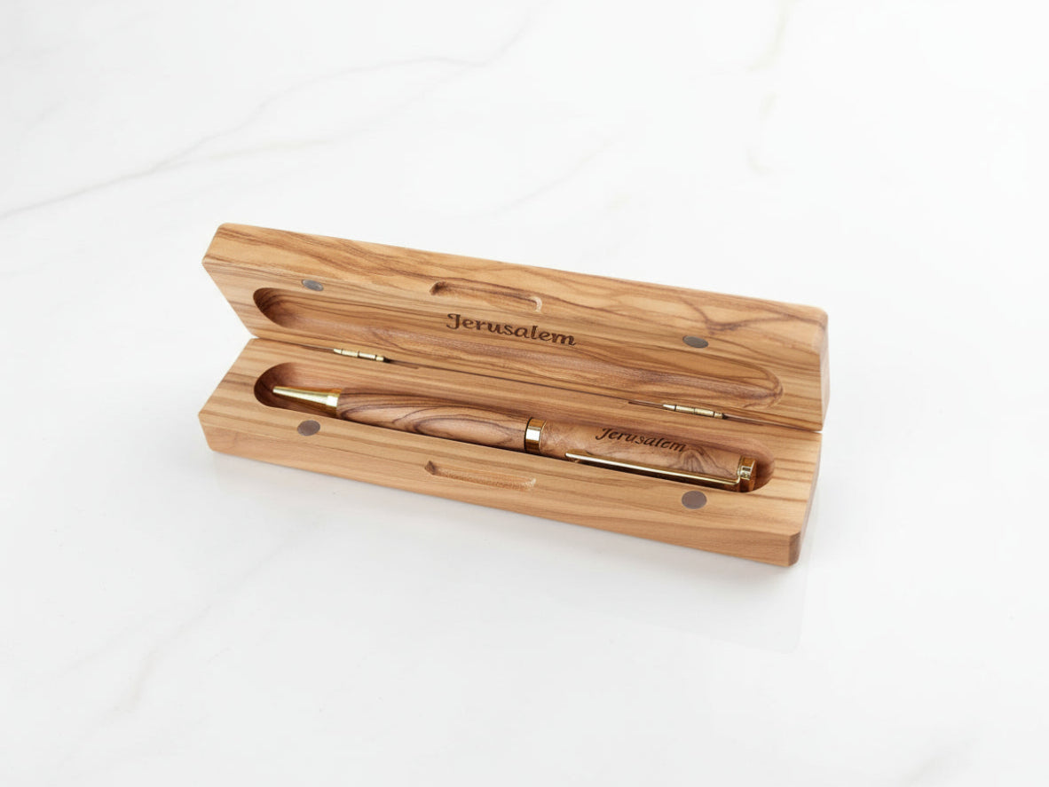 Handmade olive wood pen and box engraved with Jerusalem, crafted in Palestine — personalized wooden gift set for Christmas or corporate occasions.