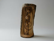Hand-carved olive wood Holy Family figurine with natural bark exterior, Nativity carving from the Holy Land on wooden table