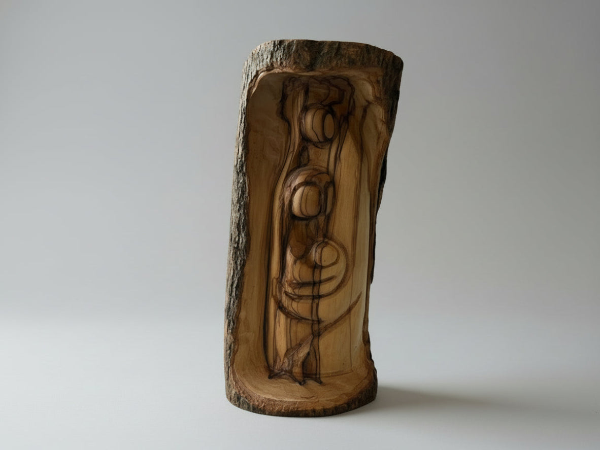 Hand-carved olive wood Holy Family figurine with natural bark exterior, Nativity carving from the Holy Land on wooden table