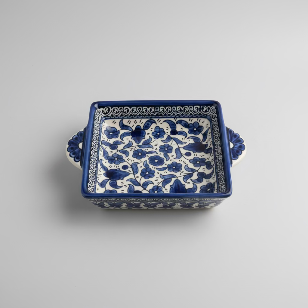 Ceramic tray with blue floral pattern on a wooden floor
