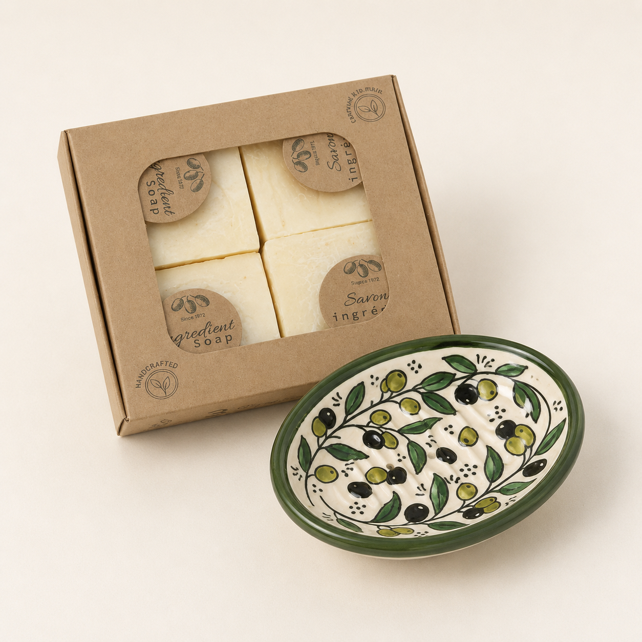 Box of soaps with a decorative ceramic bowl on a light background