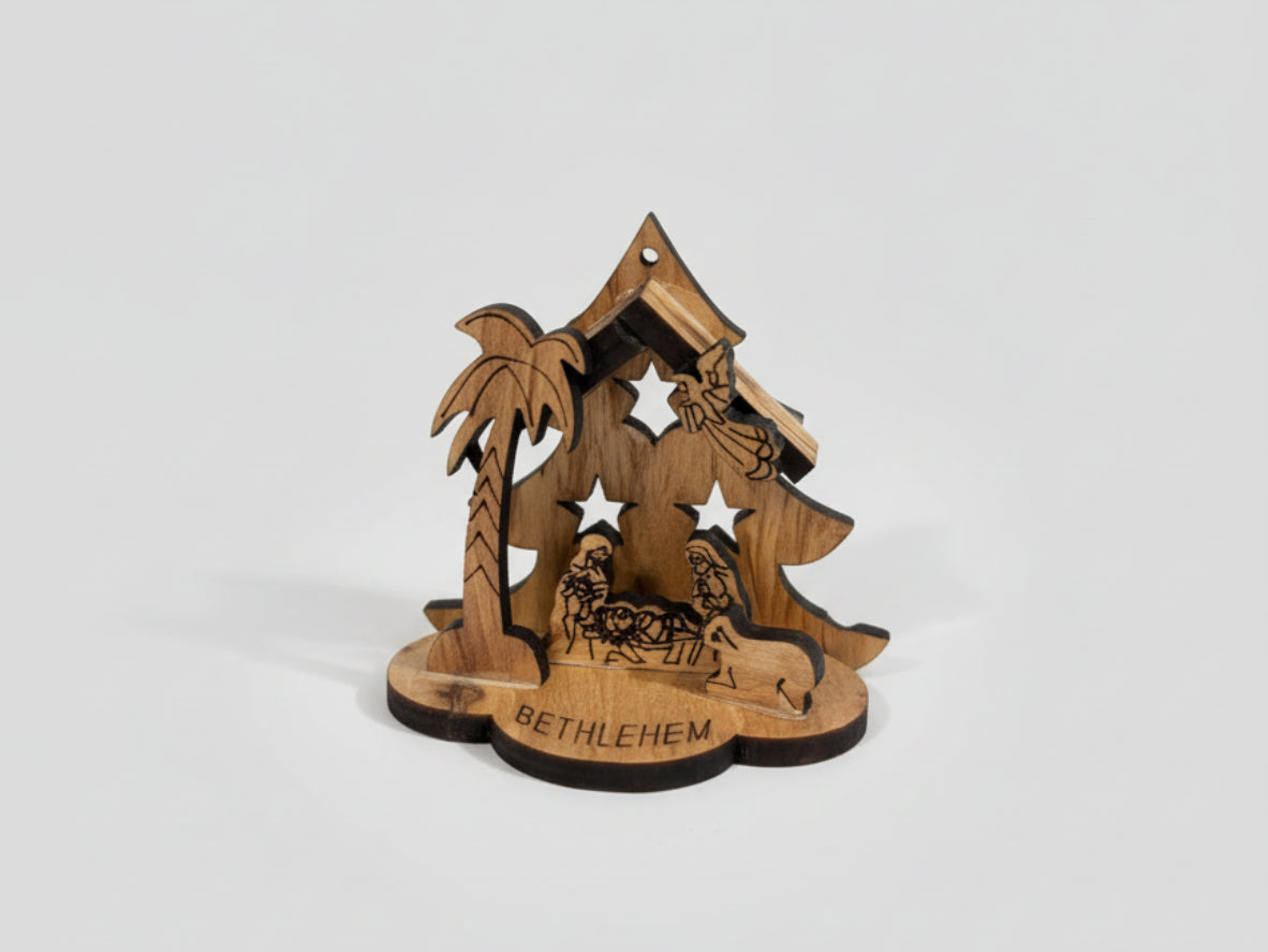 Wooden nativity scene with 'Bethlehem' sign on a wooden surface