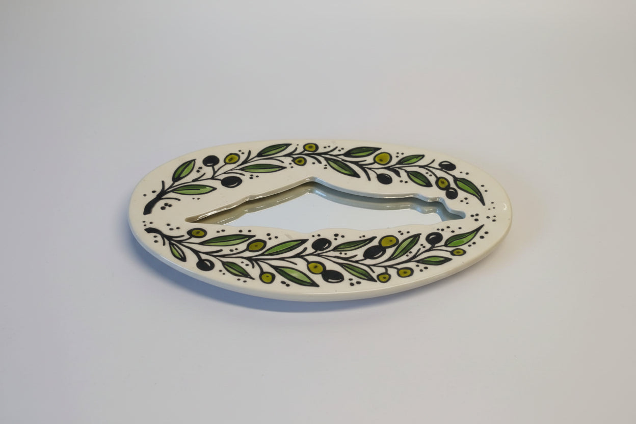 Decorative letter 'O' with floral design on a white background