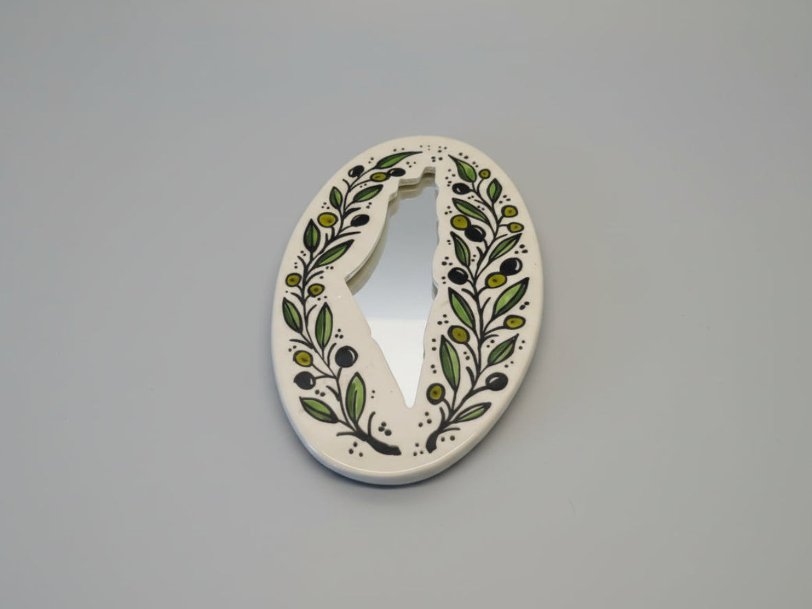Decorative letter 'V' with floral patterns on a white background