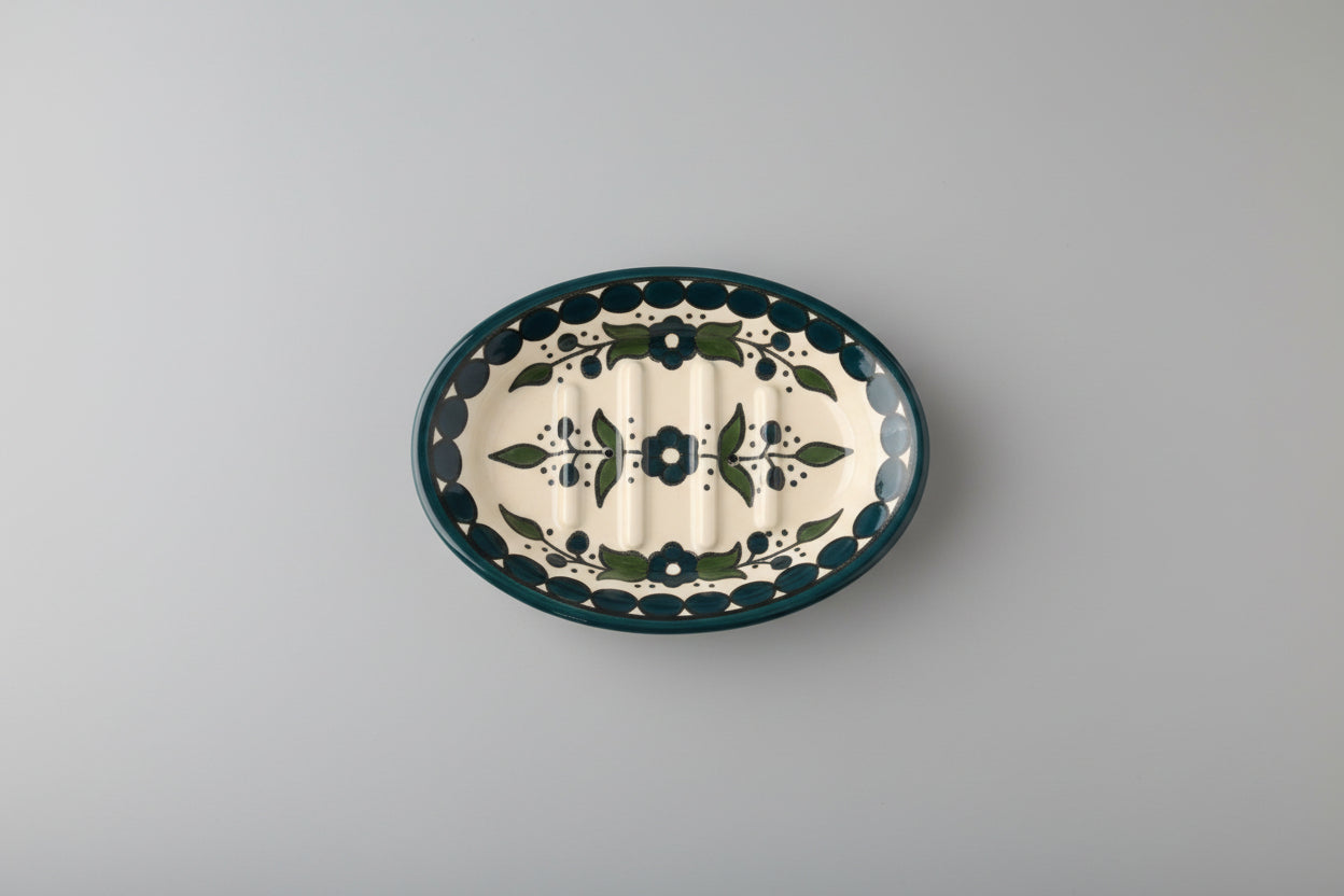 Ceramic plate with floral design on a wooden surface