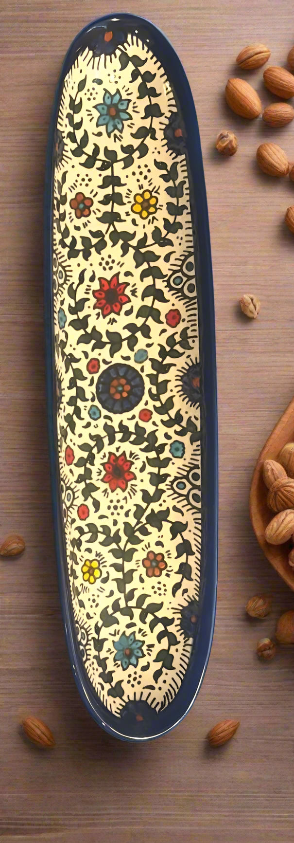 Decorative long object with floral patterns on a blue background