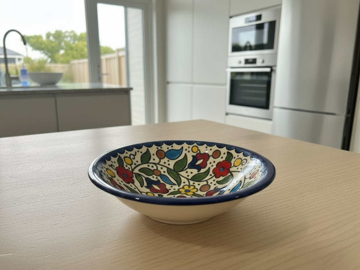 Decorative ceramic bowl with floral patterns on a white surface